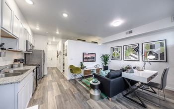 Luxury simulated wood flooring at entry, living areas, kitchen and baths